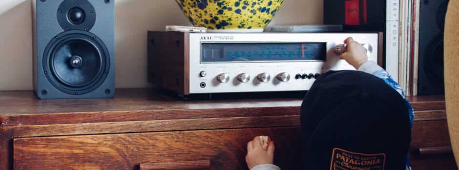 person holding AC receiver